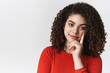 © Cookie Studio - Close-up stylish confident good-looking tender young mixed-race woman dark curly hairstyle lean head index finger smirking delighted curious look thoughtful camera have interest conversation