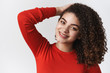 © Cookie Studio - Close-up romantic tender flirty young sensual woman dark curly hairstyle touching haircut grinning camera seducing posing coquettish grinning chuckling cute standing white background