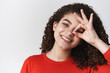 © Cookie Studio - Headshot lively charismatic happy smiling toothy young attractive girl dark curly hairstyle tilting head shaking energized show okay ok perfection gesture look circle through idea grinning