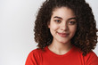 © Cookie Studio - Headshot gorgeous sensual young attractive girl curly dark hairstyle big curls smiling tenderly look gently camera delighted standing happy relaxed white background have conversation listen you