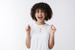 © Cookie Studio - Oh yes yeah. Excited happy triumphing cute curly-haired successful winning girl scream gladly cheering closed eyes yelling out loud celebrating victory receive awesome perfect news achieve goal
