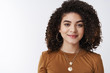 © Cookie Studio - Stylish good-looking happy carefree dark curly-haired girl smiling delighted wear trendy necklace grinning tender gladly listen conversation attend company meeting look pleasant, white background