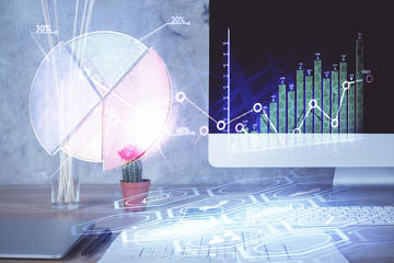 Stock market graph and table with computer background. Multi exposure. Concept of financial analysis.