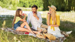 © Prostock-studio - Parents and daughter enjoying picnic in countryside