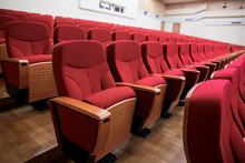 Close-up Shot Of Red Chair Seats In Empty Conference Room