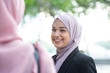 Muslim business woman talking