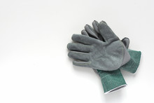 Pair Of Grey Leather Work Gloves On White Background. Protective Gloves For Working. Copy Space.