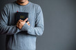Man holding a bible , believe concept.copy space
