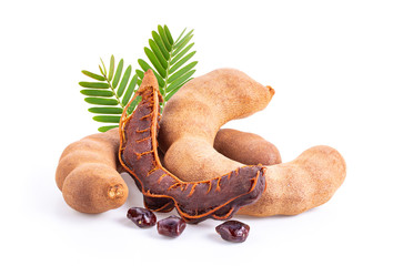 fresh tamarind fruits and leaves isolated on white. full depth of field