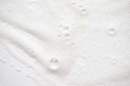 Wall Mural - Abstract background white soapy foam texture. Shampoo foam with bubbles
