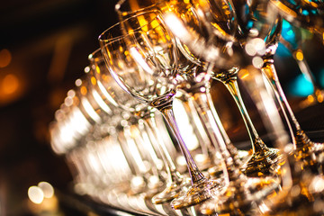 Wall Mural - Beautiful wine glasses in the bar, blurred background. Selective focus