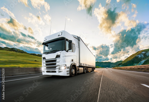 Fotomural Truck with container on road, cargo transportation concept.