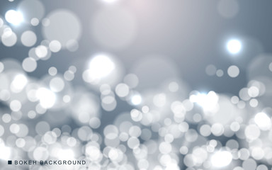 Silver abstract bokeh background sparkling lights effect. Blured circle on gray background.