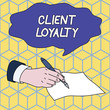 Text sign showing Client Loyalty. Business photo showcasing The result of consistently positive satisfaction to clients Male Hand Formal Suit Holding Ballpoint Pen Blank Piece of Paper Writing