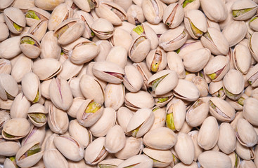 Pistachio texture. Green fresh pistachios as texture. Healthy and energetic snack                            