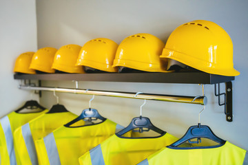 Yellow hard hat safety construction helmets. Job security protection concept image.