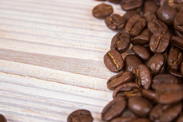 mockup of coffee beans on isolated wooden textured background