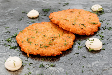 Potato pancakes, sauce on dark background, cafe menu, simple national Slavic food.