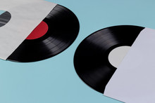 Two Vinyl Records Inside The Cover Isolated On Blue Background