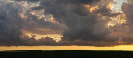 Sticker - Leaden, storm clouds covered the sunset. Cumuliform cloudscape on blue sky. The terrain in southern Europe. Fantastic skies on the planet earth. Tragic gloomy sky.	