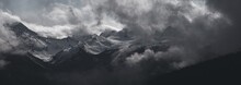 Whistler - Panorama Of Dramatic Snow Covered Alpine Peak Surrounded By Storm Clouds