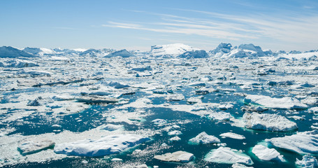 Wall Mural - iceberg and ice from glacier in arctic nature landscape on greenland. aerial photo drone photo of ic