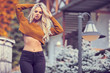 © ZoomTeam - Outdoors lifestyle fashion portrait of happy stunning blonde girl.