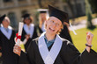 © zinkevych - Happy red-haired boy being glad graduating from the university.