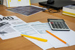© Tania - tax forms 1040, calculator, part of notebook and pen on the table