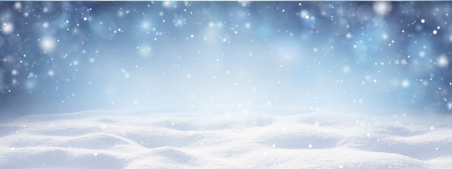 Poster - Winter snow background with snowdrifts, with beautiful light and snow flakes on the blue sky in the evening, banner format, copy space.