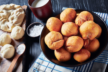 Wall Mural - Jamaican Fried Dumplings in a black bowl