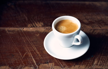 Wall Mural - Cup of espresso coffee on rustic wooden background