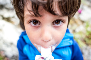 The boy got dirty with ice cream.