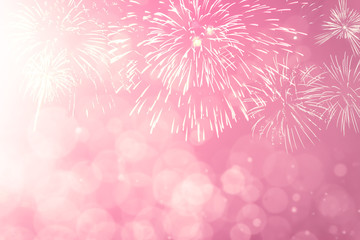 Wall Mural - pink fireworks with abstract bokeh background