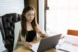 © naluenai - Business concept. Young businesswoman is working hard. Young Asian business people are happy to work outside.