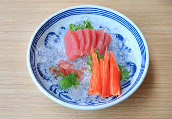 Canvas Print - Tuna Sashimi served with Seaweed and Crab sticks on ice. Raw fish in traditional Japanese style food.