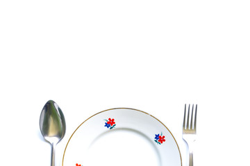 Wall Mural - served table for meals. Fork, spoon and plate - simple breakfast, lunch or dinner.