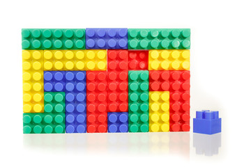 Children's colorful plastic construction toy bricks on white