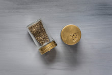 Golden Salt & Pepper Container On Grey Backdrop ( Spice Mill)
