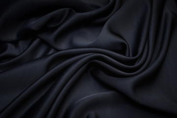 Black viscose fabric texture. Jersey. Background, pattern.