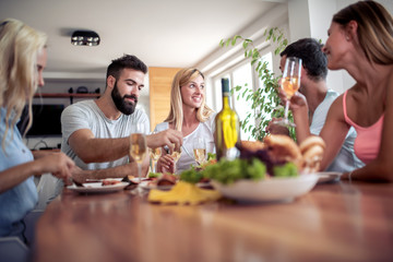 Poster - Group of happy friends eating at home