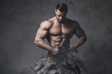  Bodybuilder Made Himself From The Piece Of Stone. Concept Of Self Improvement And Bodybuilding Progress.