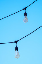 Lamp Garland Hanging On Blue Sky, Summer Day