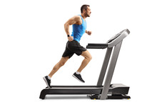 Young Man In Sportswear Running On A Professional Treadmill