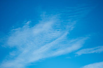 deep blue sunny sky with white clouds