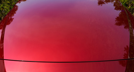 Close up of red metallic paint coating car body