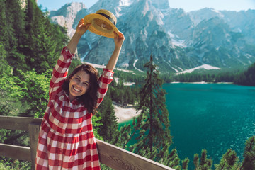 Poster - woman standing in front of lake in mountains