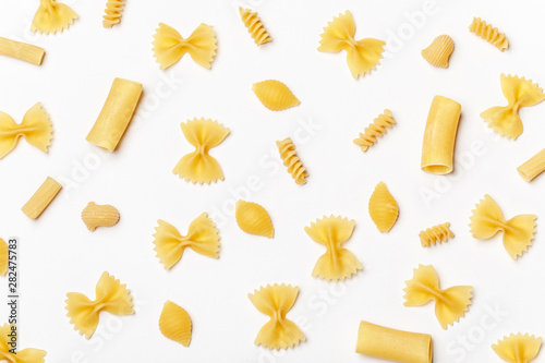 Cuadros en Lienzo Various uncooked pasta on white background