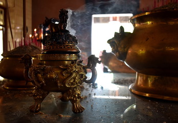 Sticker - Golden incense burner burning at a Chinese temple