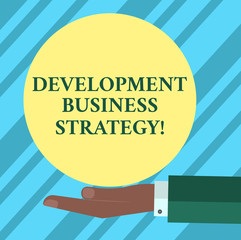 Fototapete - Text sign showing Development Business Strategy. Conceptual photo Longterm business planning Strategic plan Hu analysis Hand in Suit Offering Blank Solid Color Circle for Logo Posters